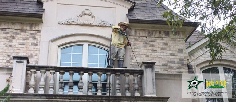 professional working on dallas landscape maintenance weekly