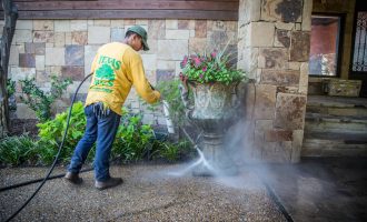 professional doing power wash in dallas